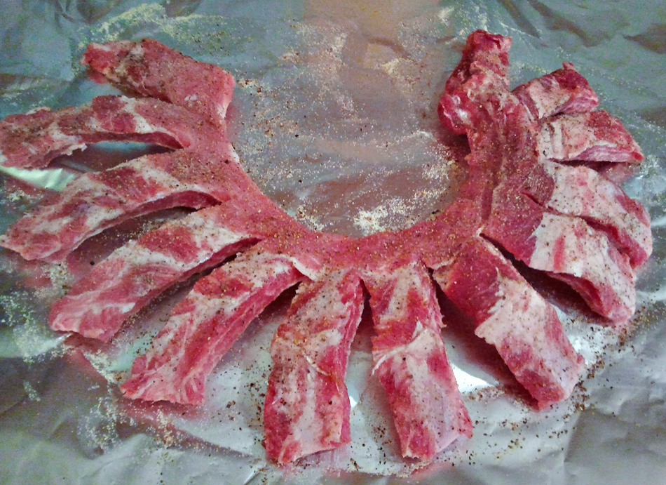 Slice ribs amost, but not quite through & fan them out on the foil.